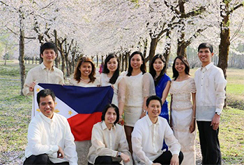 JDS Fellows from the Philippines photographed under a cherry tree